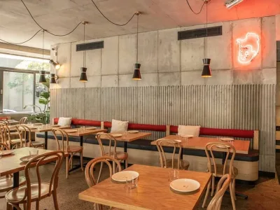 Banquette seating and fluted concrete finishes at Henrietta