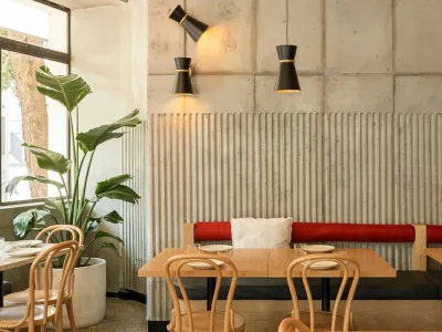 Interior seating and planting at Henrietta Charcoal Chicken