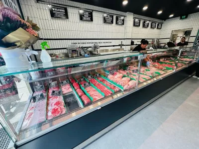 Refrigerated serve-over display along the service counter