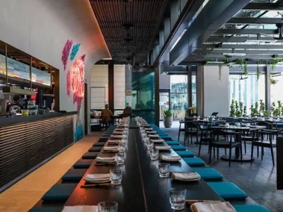 Long communal table set for service at LILYMU