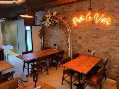 Timber tables and exposed brick in the Pasta La Vista dining area