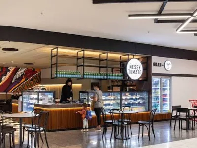 Cafe counter and refrigerated display at The Messy Tomato